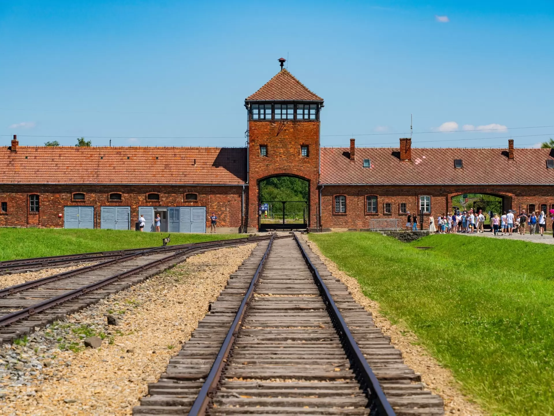 Railway tracks lead to the gate house at Auschwitz II-Birkenau concentration camp in Poland. 
