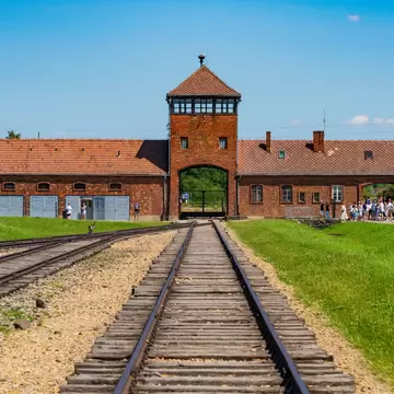 Railway tracks lead to the gate house at Auschwitz II-Birkenau concentration camp in Poland. 