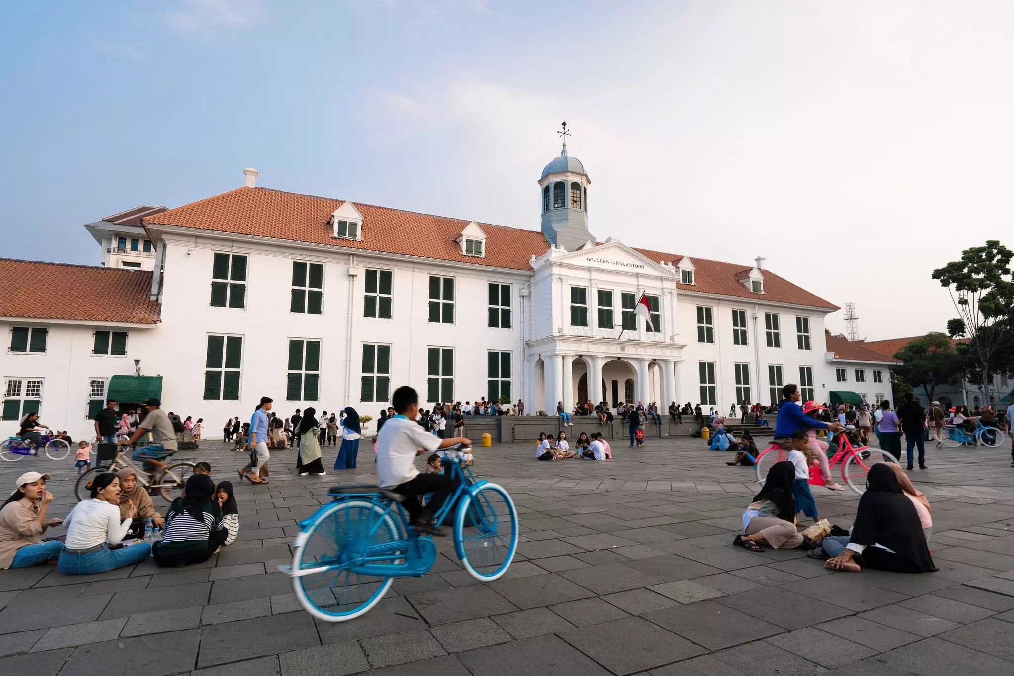 People relaxing in Fatahillah Square, the historical center of old Batavia in Jakarta, Java, Indonesia.