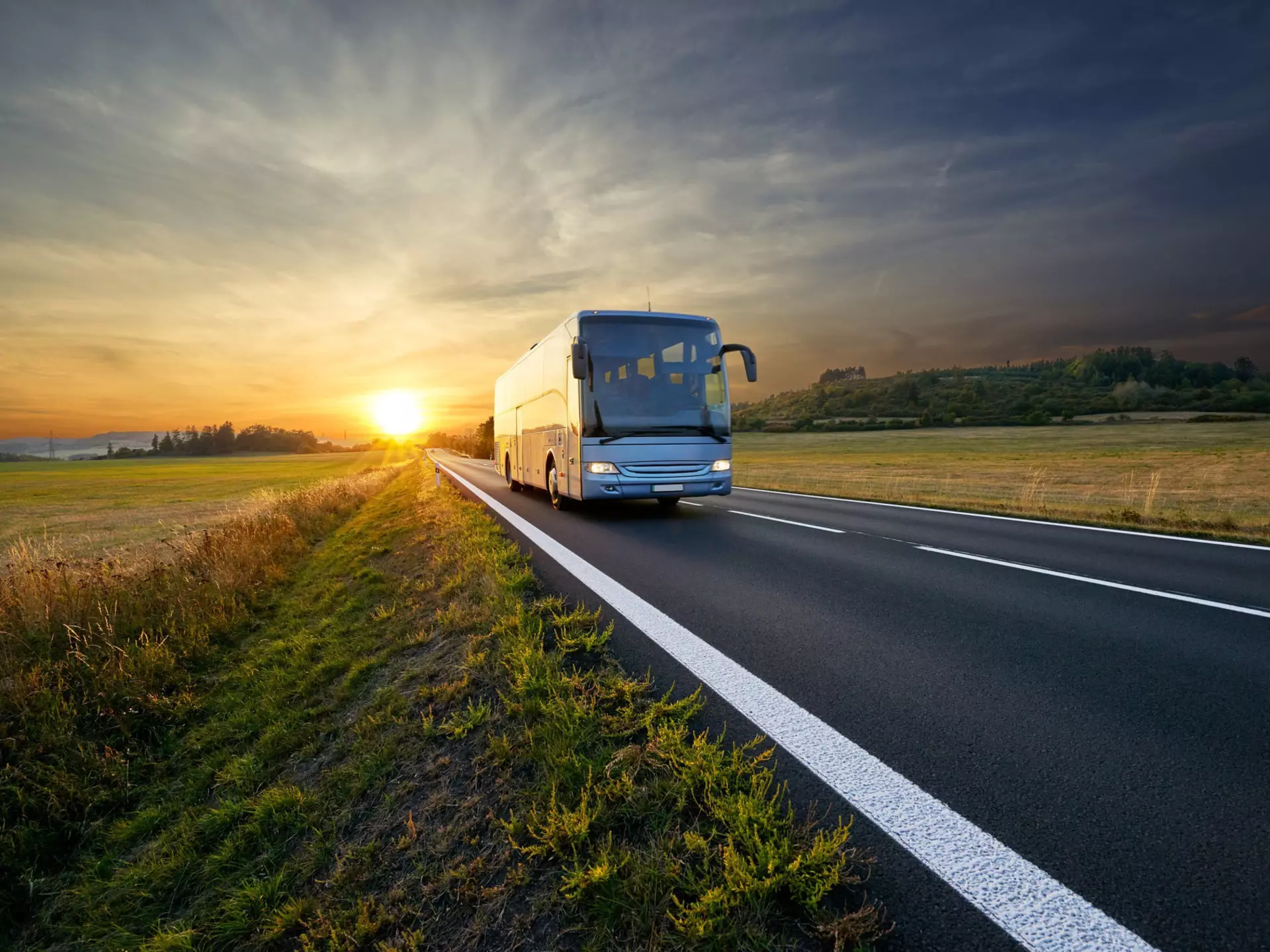 Bus traveling on an asphalt road in a rural area of Czech Republic during sunset.
1095141322
Woodland, Public Transportation, Sunrise - Dawn, Highway, Sun, Vanishing Point, Busing, Diminishing Perspective, Land Vehicle, Gold Colored, Road, Sunny, Intercity Bus, Czech Republic, Horizontal, Photography, Outdoors, Sunlight, Tree, Dawn, Forest, Meadow, Bus, Riding, Cloud - Sky, Rural Scene, Sunset, Orange Color, Coach Service, Summer, Traffic, Travel, Sunbeam, Journey, Transportation, Tourism, Scenics - Nature, Coach, Nature, bus service, Sky, Landscape - Scenery, Driving, Multiple Lane Highway