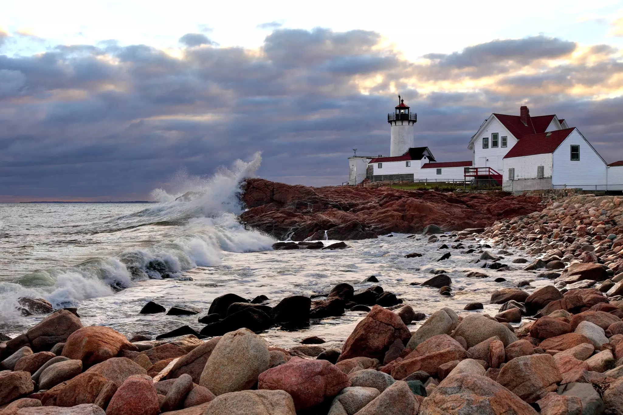 Wave crash on the rocks near Eastern Point Lighthouse on the eastern tip of Massachusetts, Gloucester Harbor, Gloucester, Massachusetts, New England, USA