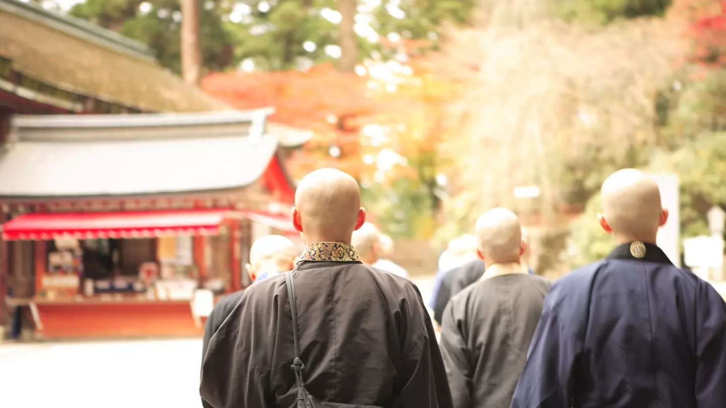 Priests advocating a sutra at the front of Enryakuji temple ,Konpotyudo, Kyoto Japan
