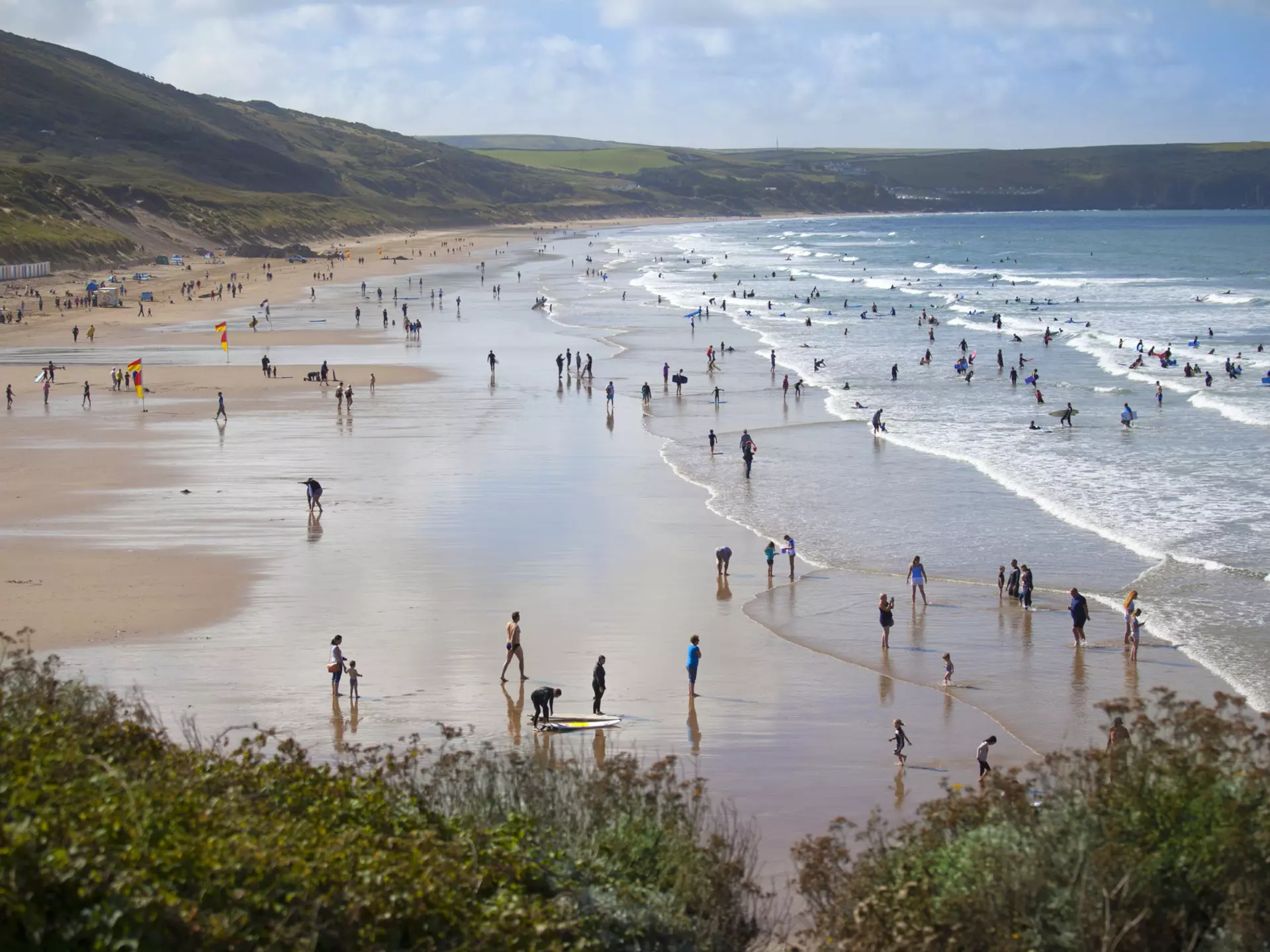 People enjoying the surfing beach of Woolacombe
509804643
Natural Landmark, Tourism, Non-Urban Scene, Leisure Activity, People In The Background, North Devon, Beauty In Nature, Tide, Body Board, Coastline, Headland, Color Image, Devon, Sunbathing, Bodyboarding, Surfboard, Idyllic, British Culture, Travel Destinations, Vacations, Outdoors, Panoramic, Horizontal, High Angle View, Surfing, Recreational Pursuit, Tourist, People, England, UK, Europe, Day, Sand, Beach, Bay, Coastal Feature, Horizon, Sand Dune, Landscape, Cloud, Sky, Atlantic Ocean, Sea, Water's Edge, Surf, Wave, Water, beach holiday, woolacombe, Travel Locations