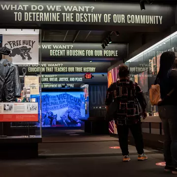 A pair of people look at an exhibit at the National Civil Rights Museum in Memphis