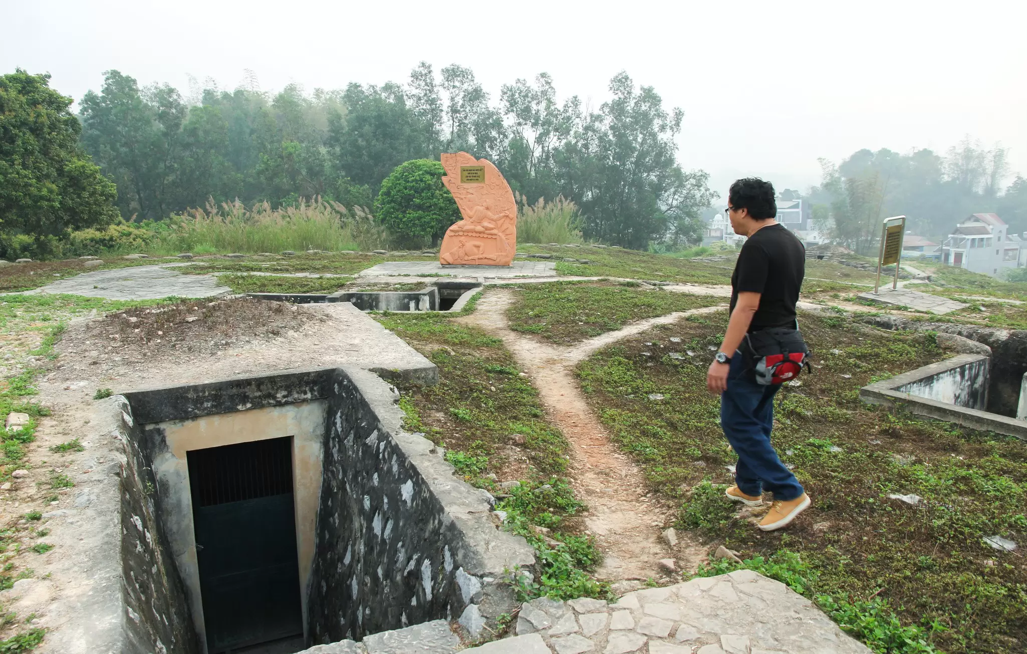 A man tours the trench warfare site at A1 Hill, from the Battle of Dien Bien Phu, Vietnam.