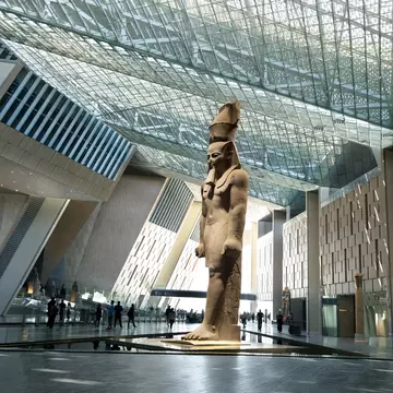 Cairo, Egypt- September 27th 2025-Massive Ancient Egyptian Ramses II Statue Standing Under the Glass Skylight of The Grand Egyptian Museum., License Type: media, Download Time: 2025-12-08T14:34:38.000Z, User: clairenaylor, Editorial: true, purchase_order: 65050 - Digital Destinations and Articles, job: Online editorial, client: Guide to Grand Egyptian Museum, other: Claire Naylor