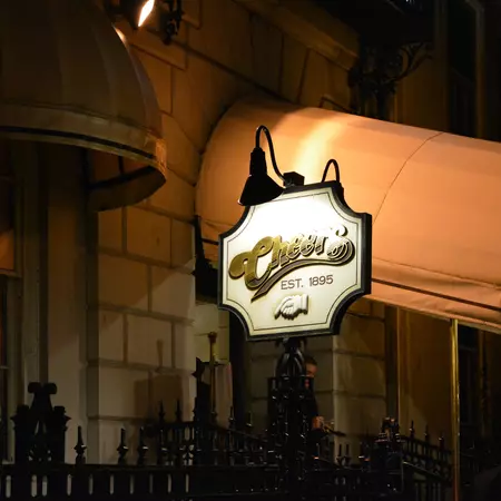 night time photo of the famous Cheers bar on Beacon street. Close up of the sign