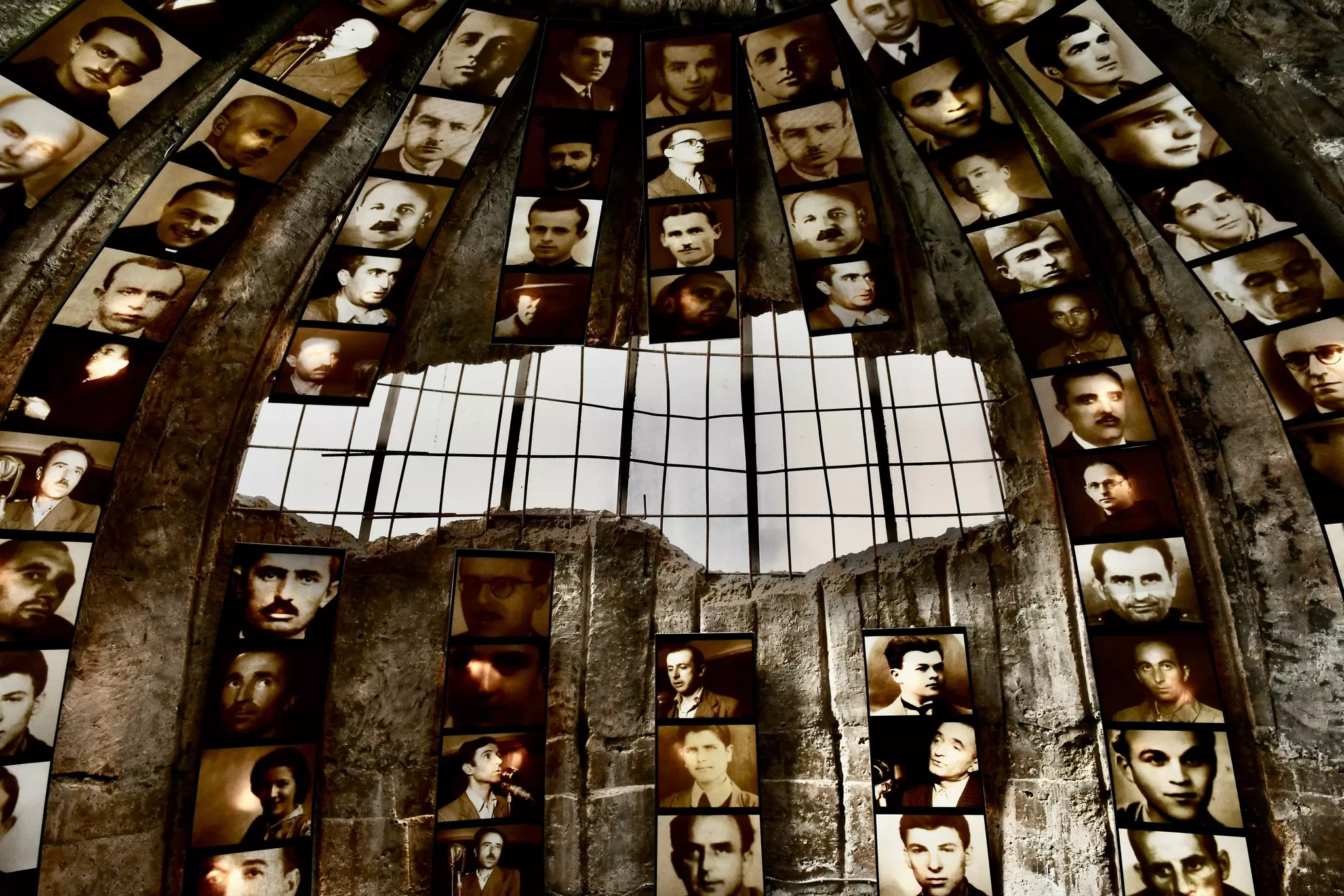 Photos installed on a museum wall in Albania.