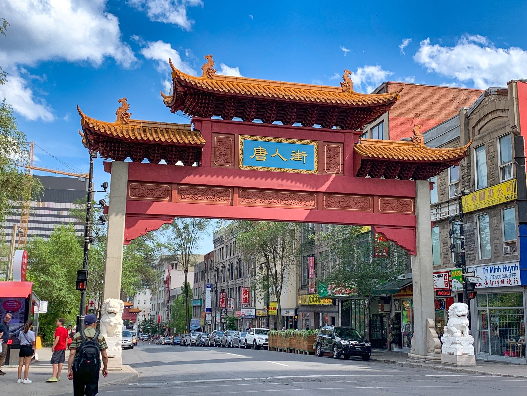 Red entry gate with engraved details and Chinese characters