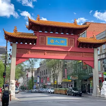 Red entry gate with engraved details and Chinese characters
