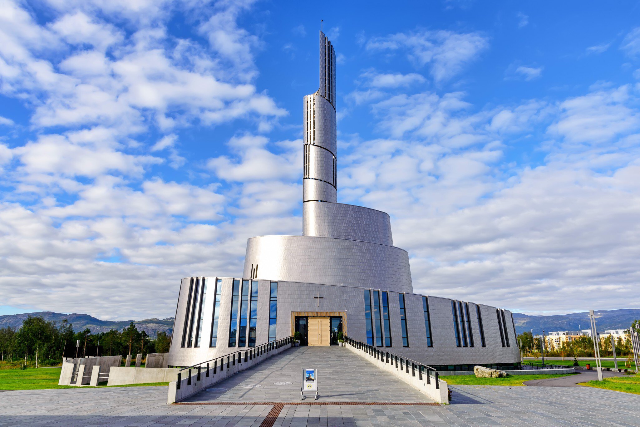 Alta, Norway - August 16, 2016: View of the main entrance side of the Northern Lights Cathedral. This modern church was built in a circular style in 2013; Shutterstock ID 1341159728;