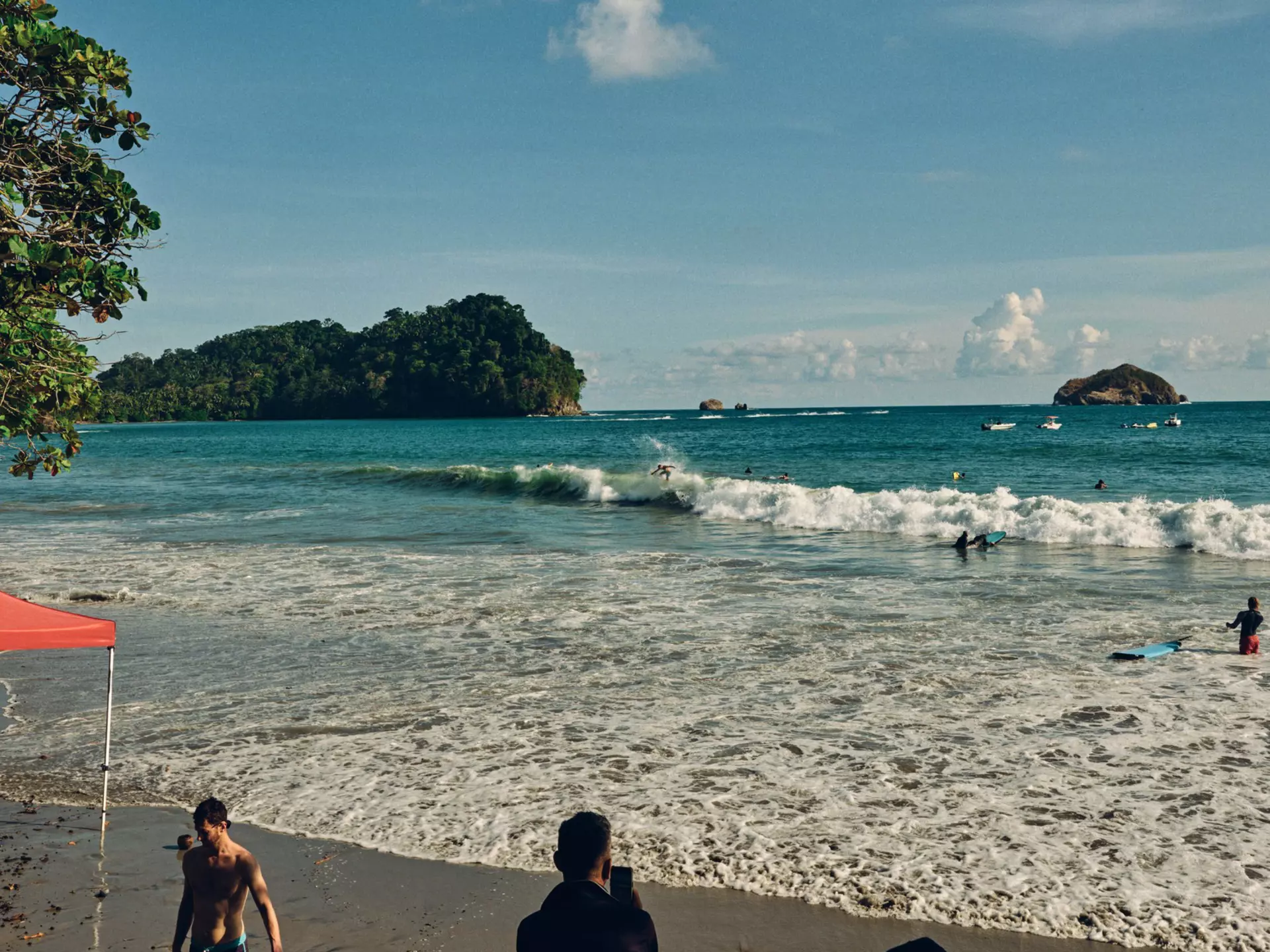 People on a beach and in the ocean