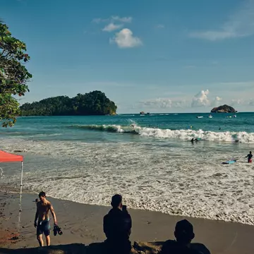 People on a beach and in the ocean