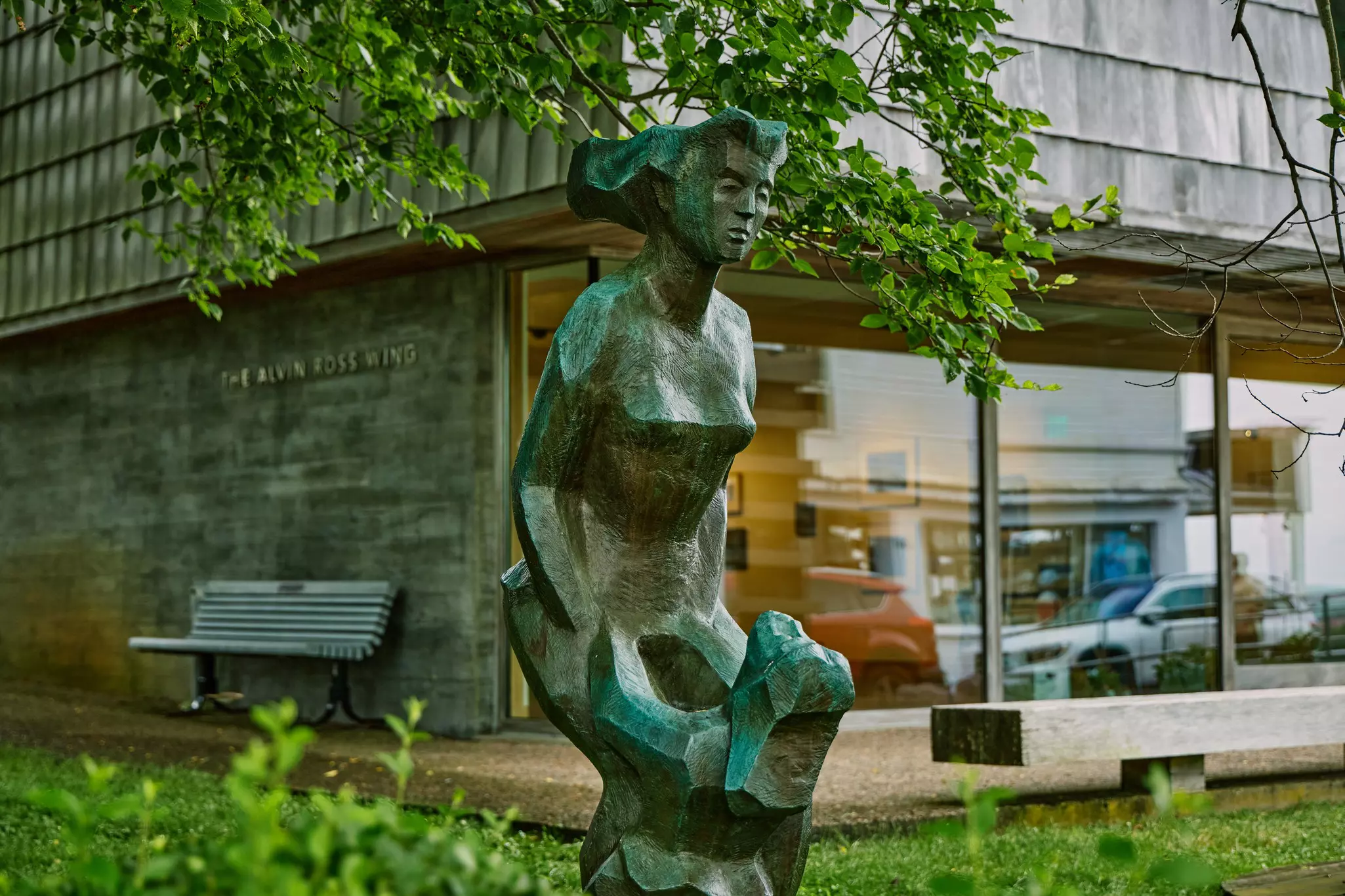 A statue of a bust of a woman in front of a modern art facade at the Provincetown Art Association and Museum
