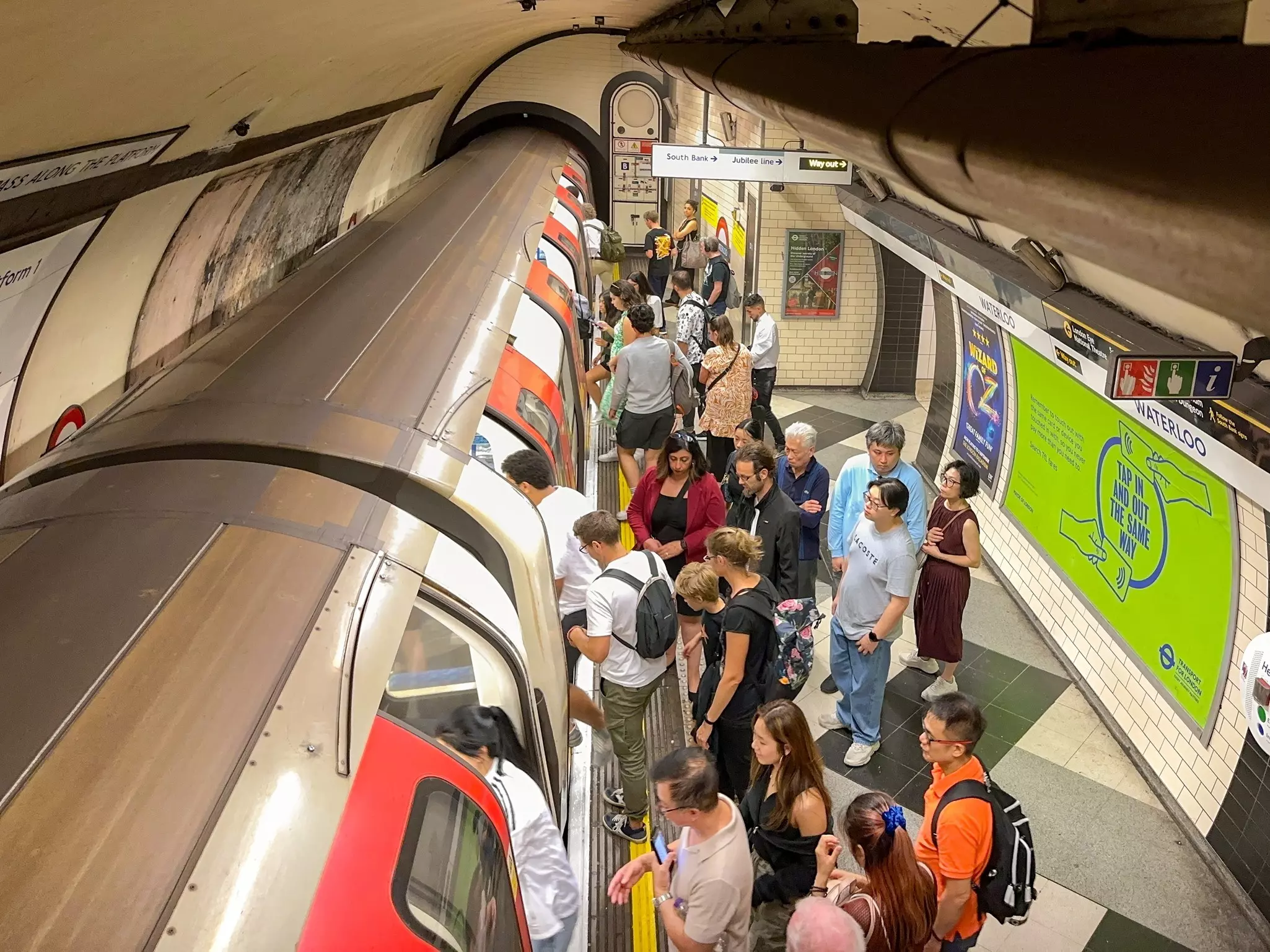 London, England, UK - 22 August 2023: Crowd of people getting on an  underground train on the London Tube, License Type: media, Download Time: 2025-01-01T13:12:53.000Z, User: Norma.PrauseBrewer_LonelyPlanet, Editorial: true, purchase_order: 56530 - Guidebooks, job: Global Publishing WIP, client: London 14, other: Norma Brewer