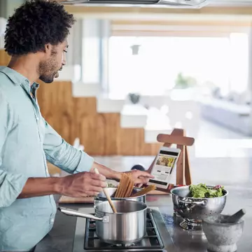 Man cooking in the kitchen while reading a recipe of a digital tablet
483963425
Connection, Portability, Preparation