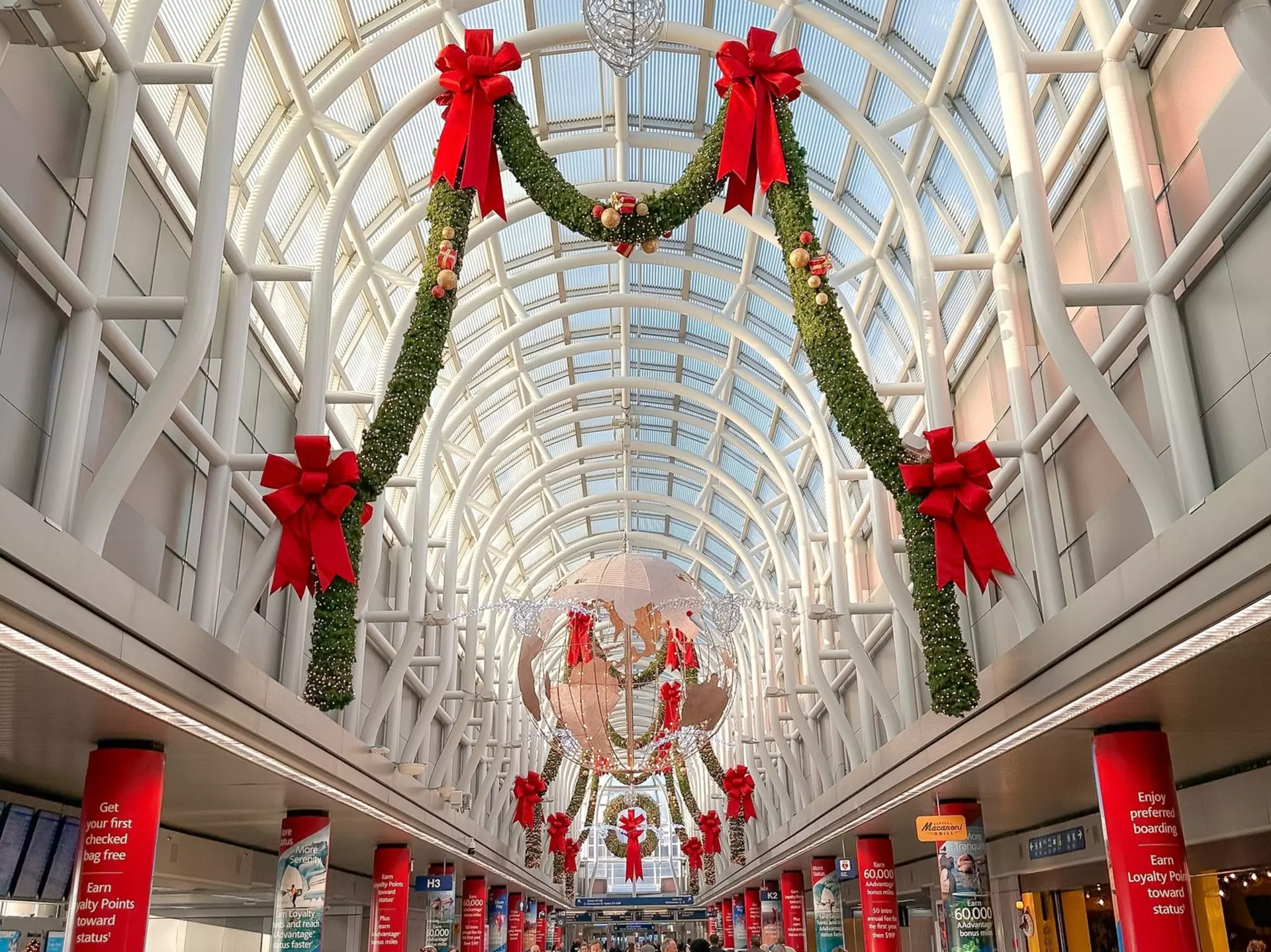 Friends embrace in railroad station at Christmas