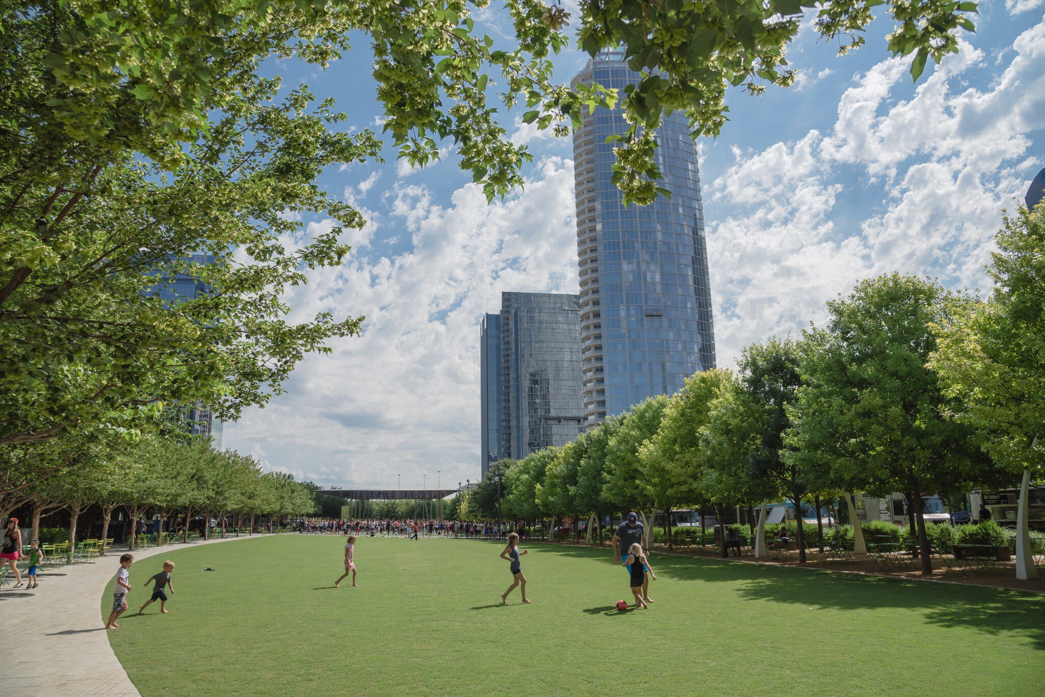 Water fountain and splash pad at the children's area in Klyde Warren Park.