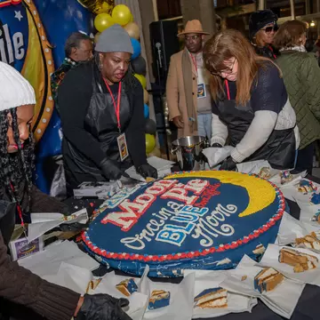 An enormous MoonPie is sliced up at MoonPie Over Mobile in Alabama.