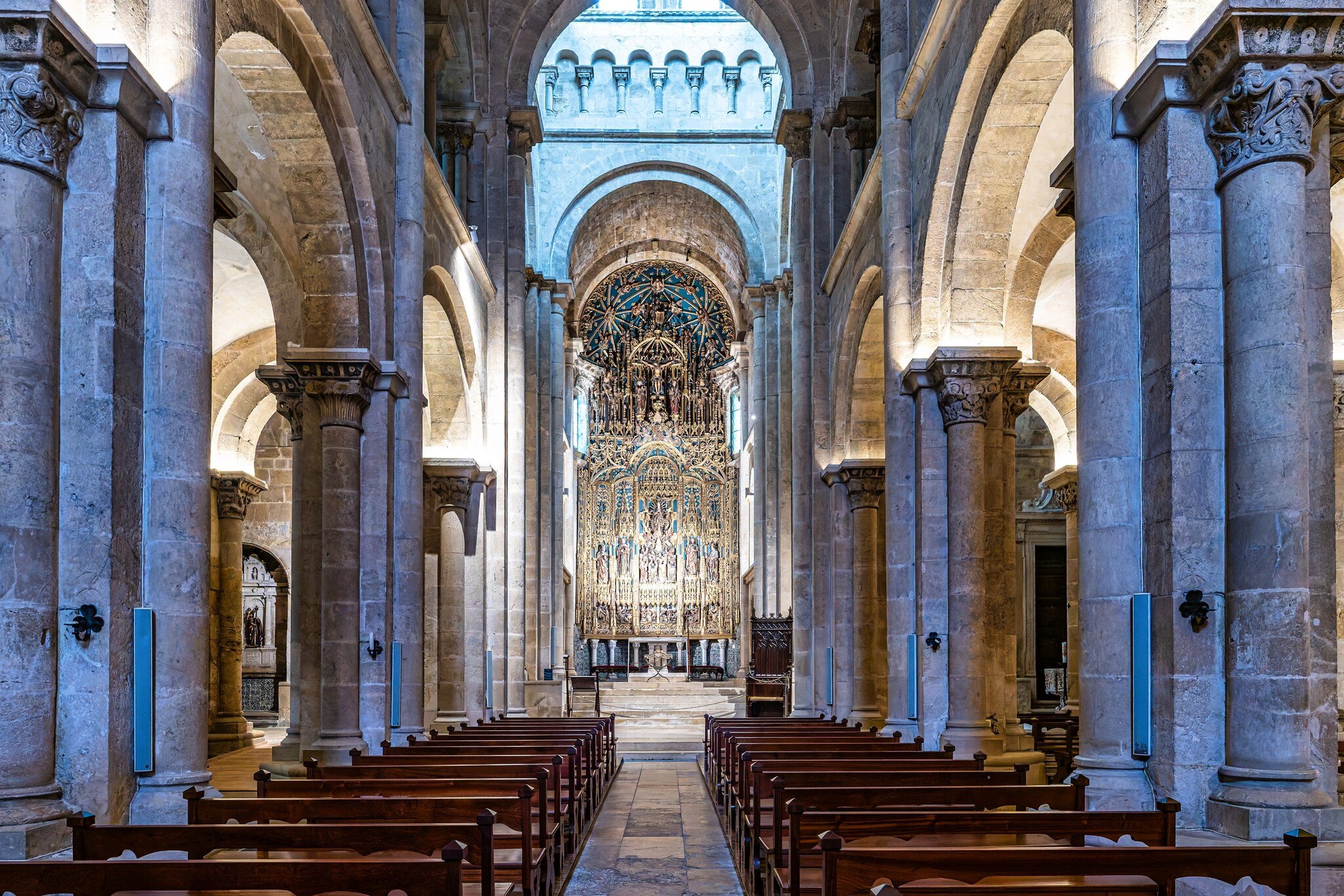 View down the central nave of the Sé Velha in Coimbra, Portugal.