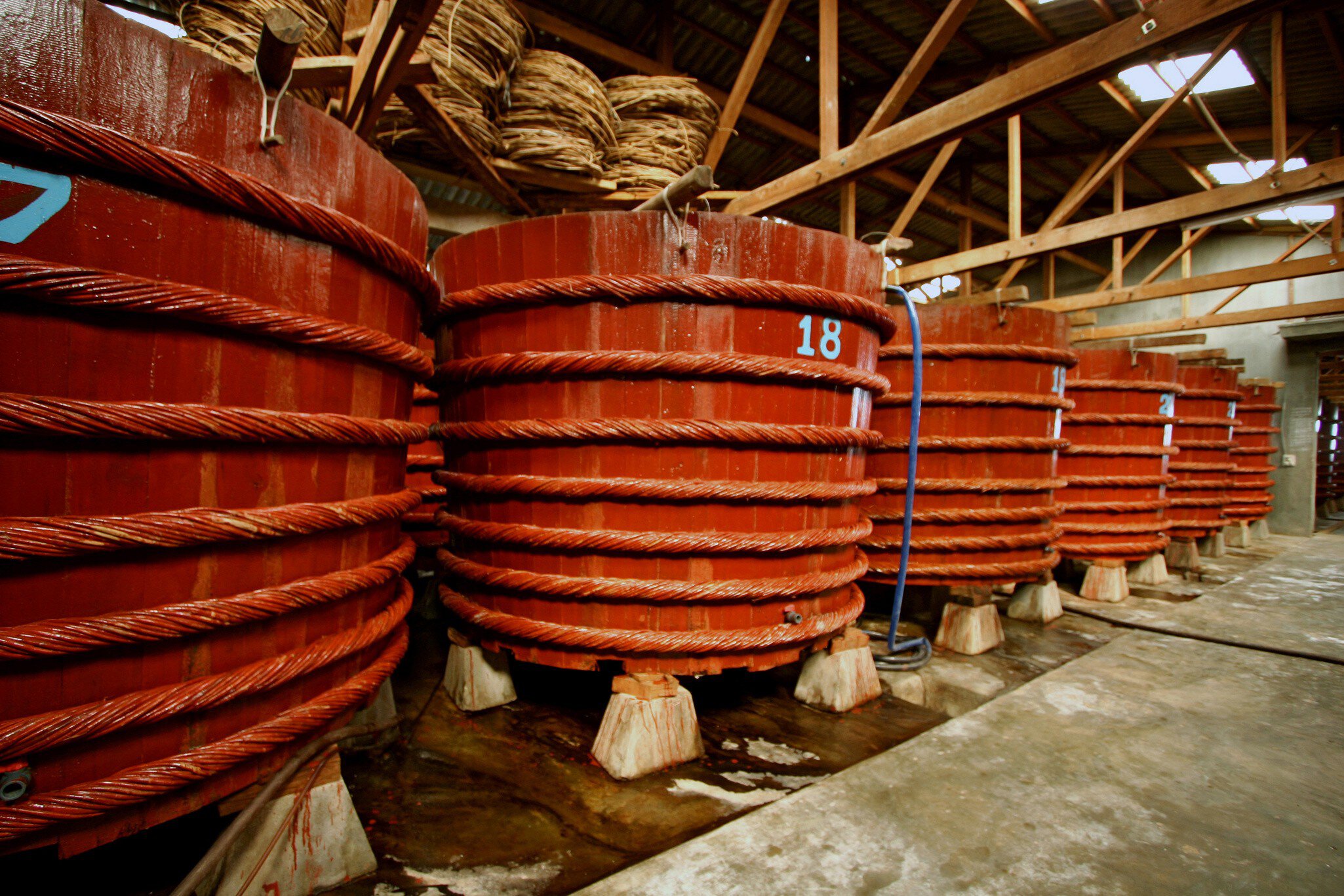 PHU QUOC, VIETNAM - 2006/02/10: Fish Sauce Nưoc Mam Vats -Besides fishing, fish sauce - a popular form of seasoning in Southeast Asian food, is the other main source of income on Phu Quoc island. Giant vats of fish sauce, such as these, are used f...