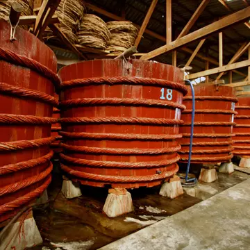 PHU QUOC, VIETNAM - 2006/02/10: Fish Sauce Nưoc Mam Vats -Besides fishing, fish sauce - a popular form of seasoning in Southeast Asian food, is the other main source of income on Phu Quoc island. Giant vats of fish sauce, such as these, are used f...