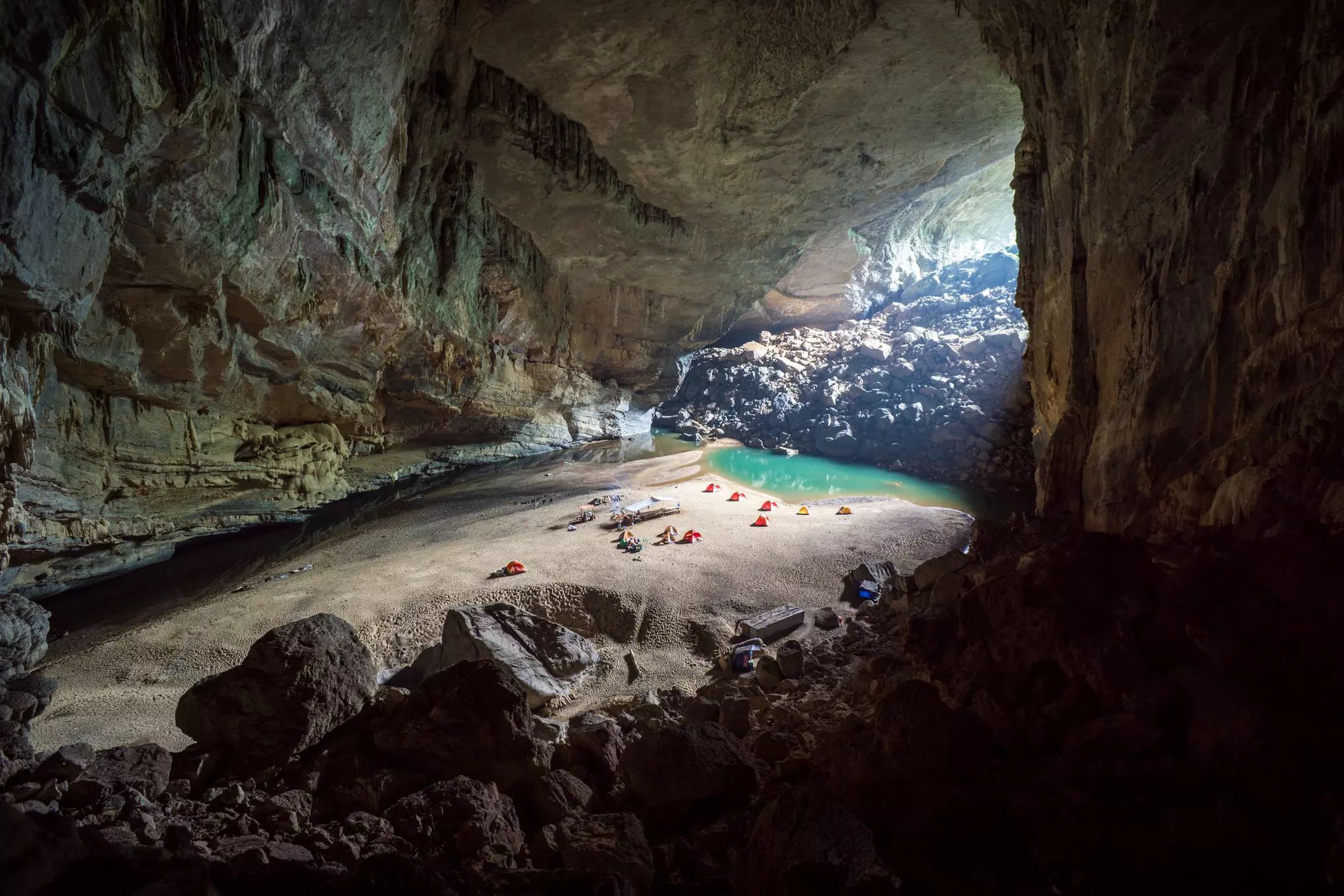 Tents set on the beach inside Hang En cave, Vietnam.