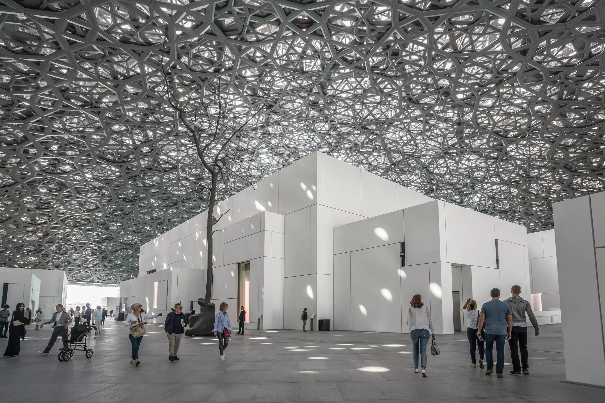 The Louvre Abu Dhabi’s massive steel dome creates a magnificent “rain of light” effect © Oleg GawriloFF / Shutterstock