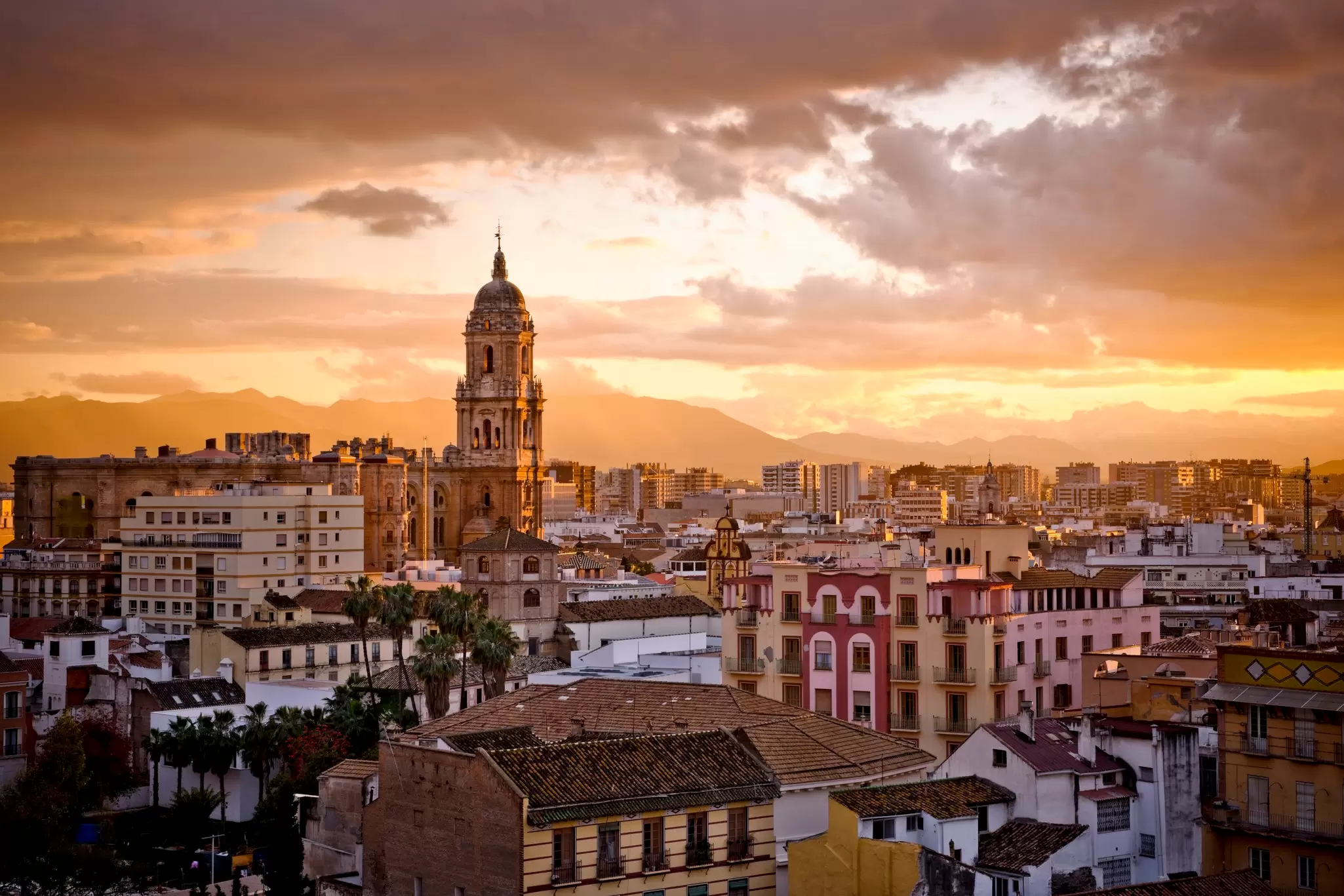 The Malaga skyline at sunset. Guillermo Perales Gonzalez / Getty Images