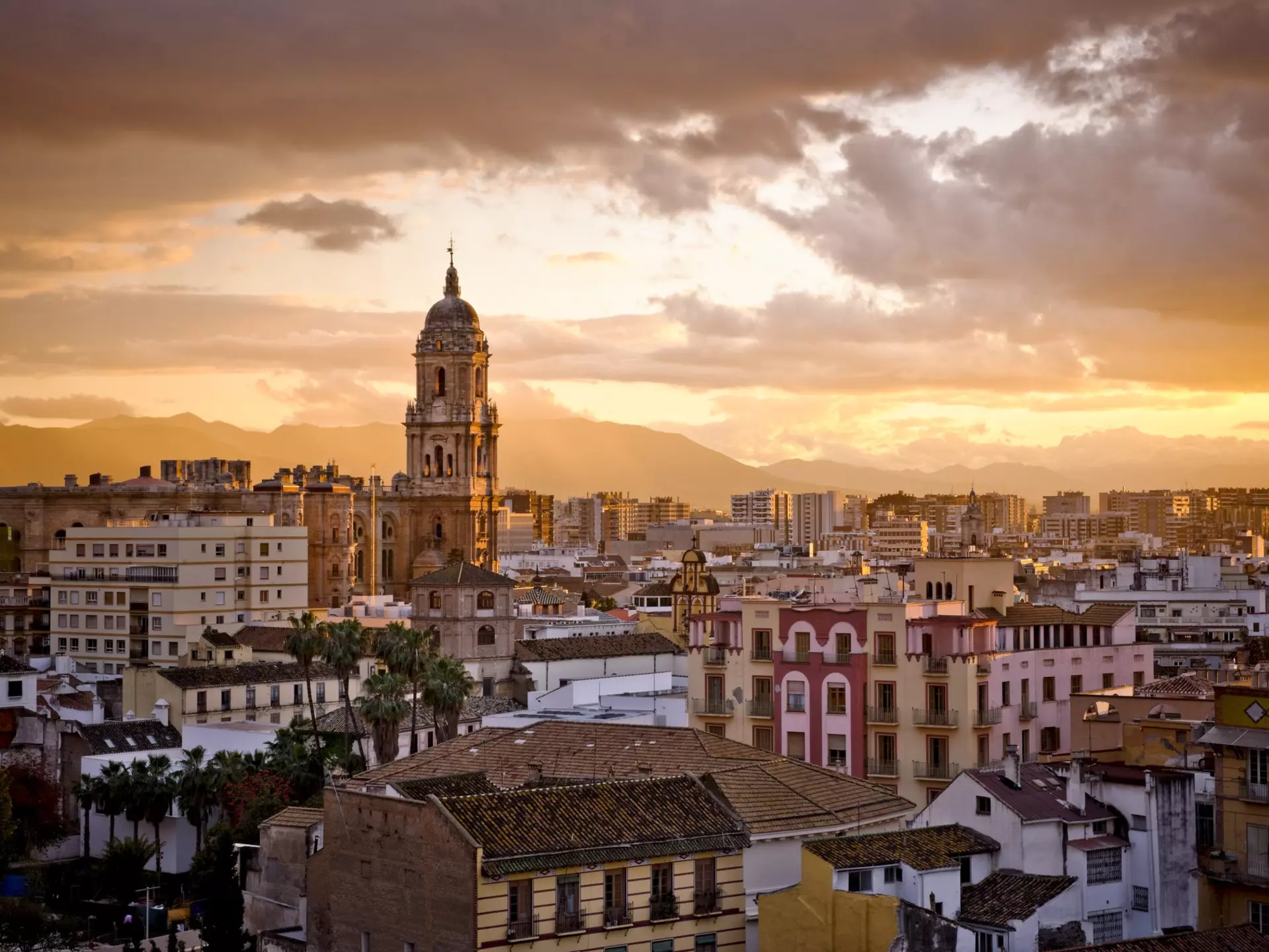 The Malaga skyline at sunset. Guillermo Perales Gonzalez / Getty Images