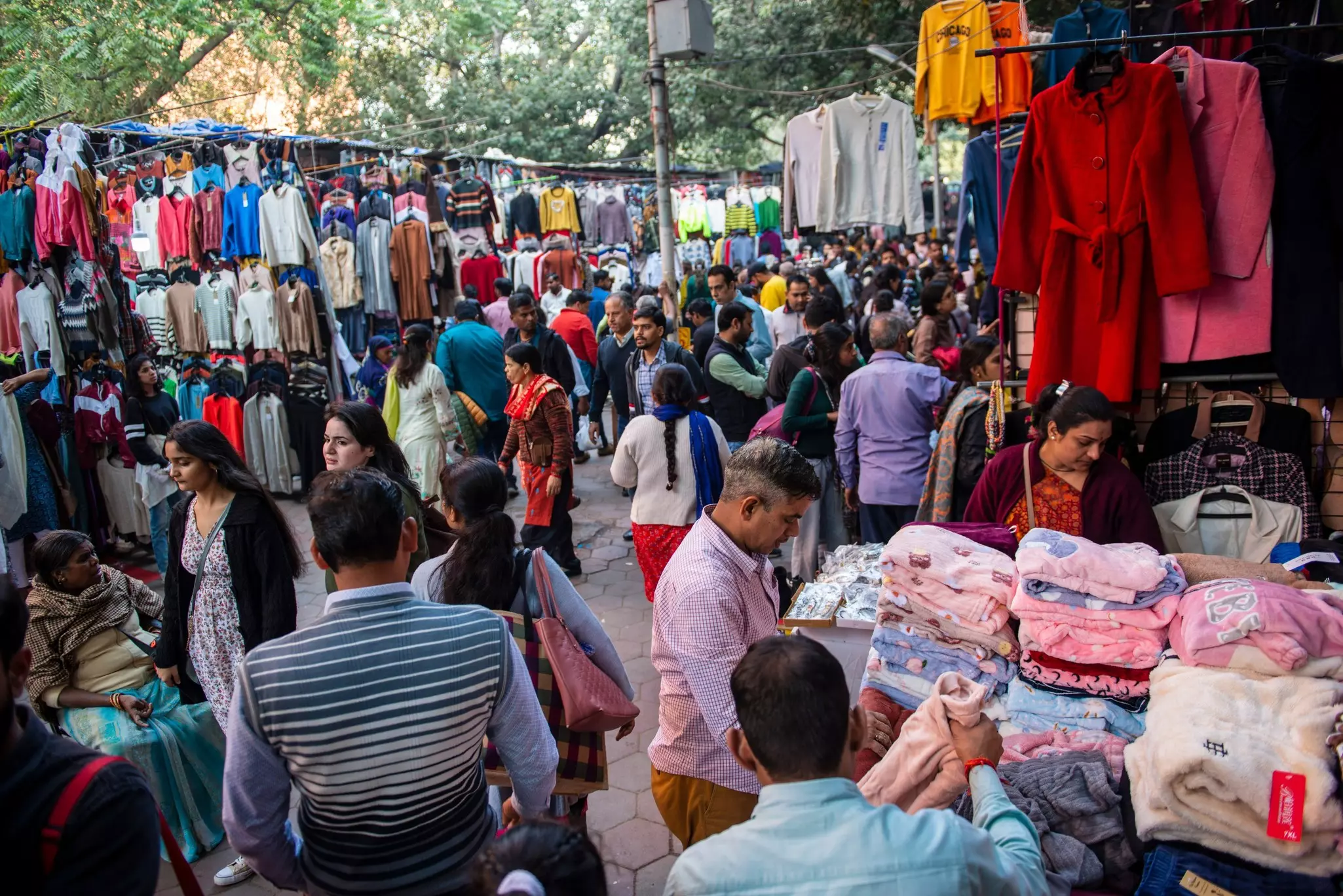 Crowds shopping in an open-air street market