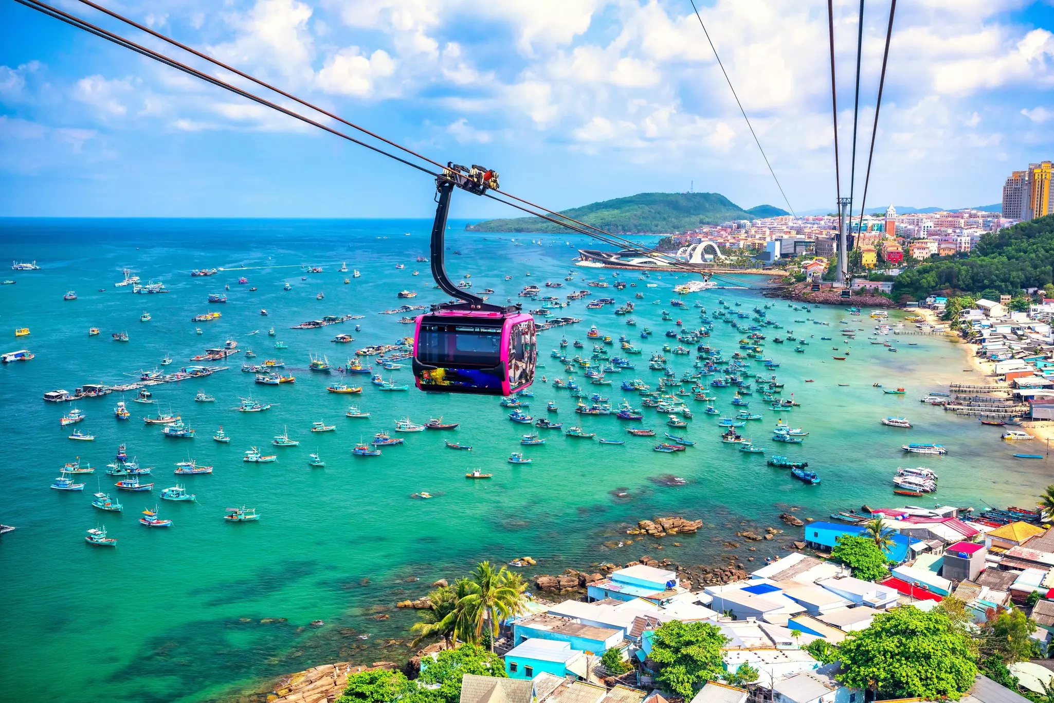 View of longest cable car ride in the world, Phu Quoc island, Vietnam. Below is seascape with tropical islands and boats., License Type: media, Download Time: 2025-04-18T20:23:40.000Z, User: Norma.PrauseBrewer_LonelyPlanet, Editorial: false, purchase_order: 56530 - Guidebooks, job: Global Publishing WIP, client: vietnam-cambodia-laos-northern-thailand-7, other: Norma Brewer