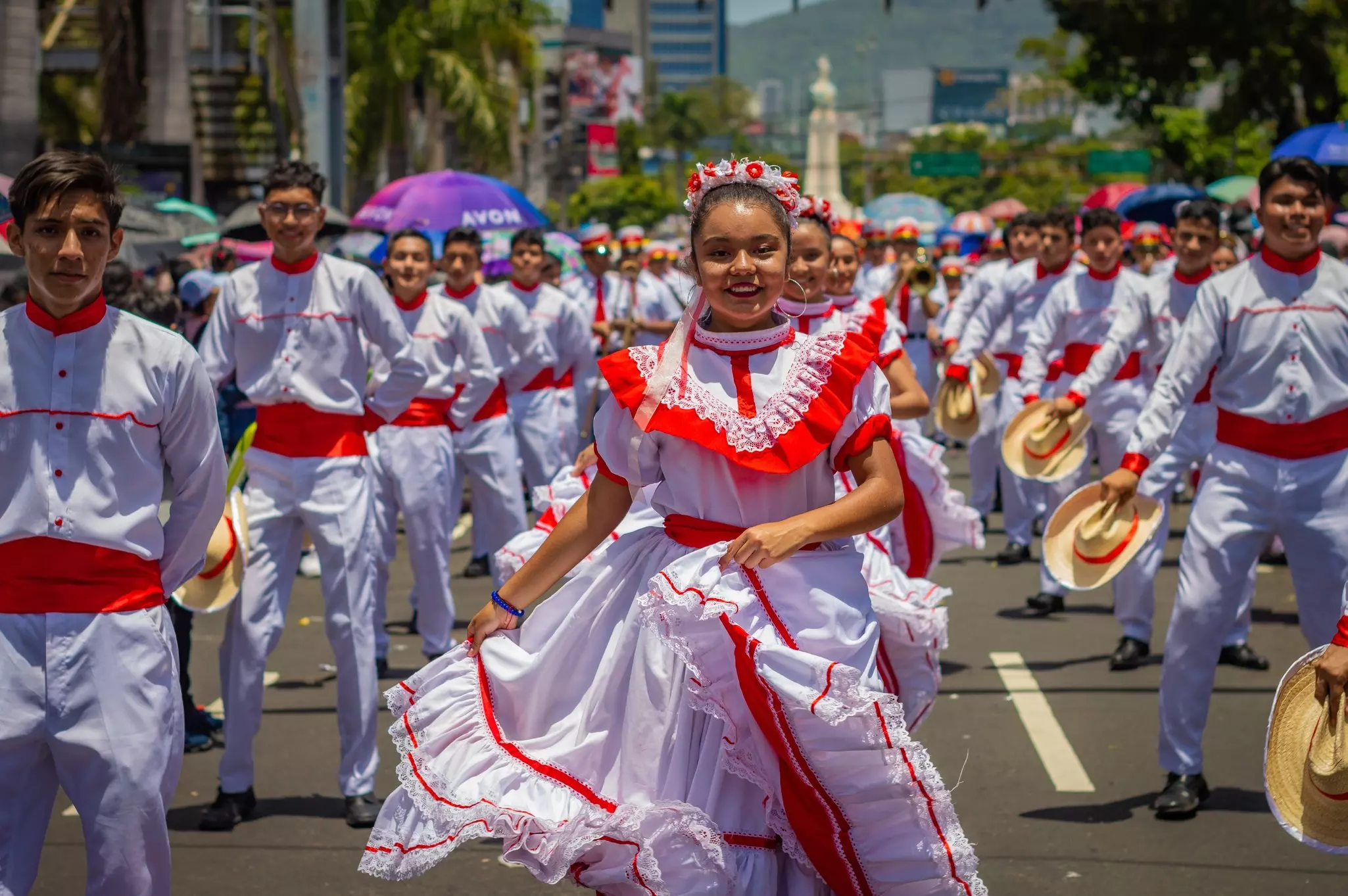 People perform traditional dances during the El Comercio parade, within the framework of the festivities to the divine savior of the world in San Salvador, El Salvador on August 03, 2022, License Type: media, Download Time: 2025-10-08T12:35:44.000Z, User: joebindloss38, Editorial: true, purchase_order: 65050 - Digital Destinations and Articles, job: Online Editorial, client:  When is the best time to visit El Salvador?, other: Joe Bindloss