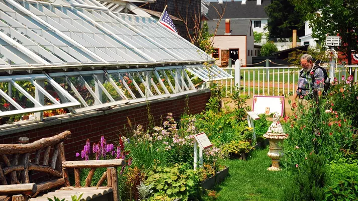 Portsmouth, NH, USA, July 15 On a summer day, flowers bloom in a garden near a greenhouse at the strawberry bank Museum in Portsmouth, New Hampshire, License Type: media, Download Time: 2026-04-10T17:16:23.000Z, User: Sarahstocking, Editorial: true, purchase_order: 65020 - Marketing or Sales - this includes sponsored articles, job: Digital , client: Summer in New Hampshire, other: Sarah Stocking