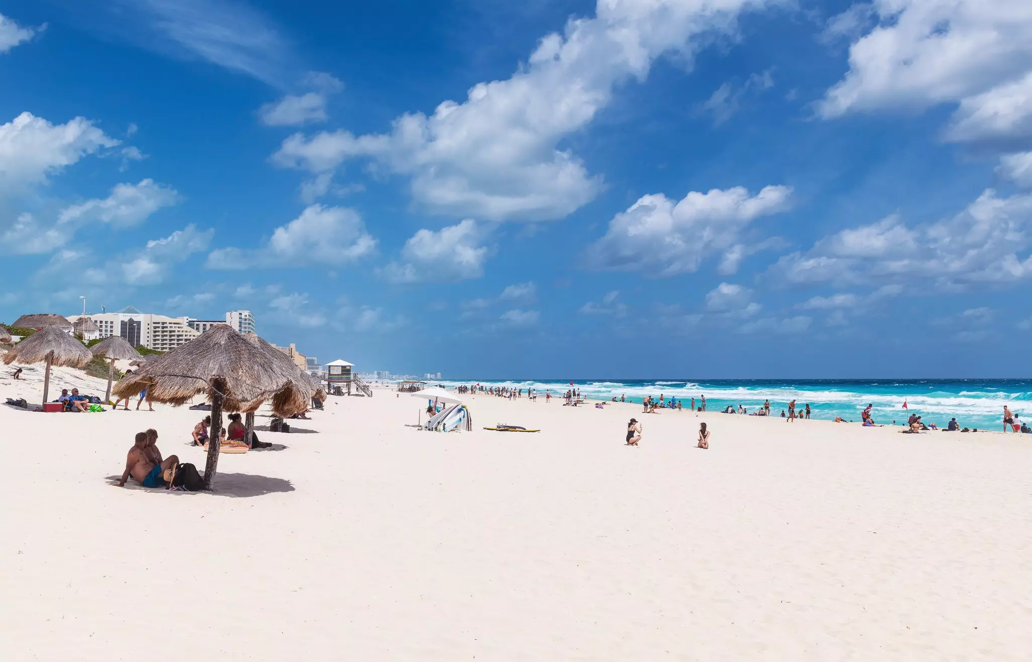People sunbathing on Playa Delfines