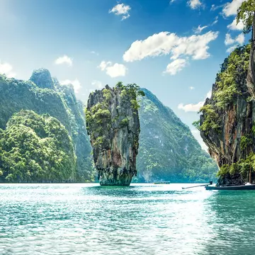 Panorama of limestone karst mountains at James Bond Island in Phang Nga Bay.
313313921
island, popular, thailand, tropics, tropical, cloud, travel, rock, excursion, landmark, attraction, summer, andaman, asia, paradise, thai, nail, place, iconic, famous, vacations, bay, tourism, sea, beautiful, water, nature, exotic, asian, landscape, phuket, destination, park, national, james, khao, kan, bond, phang, tourist, nga, phing