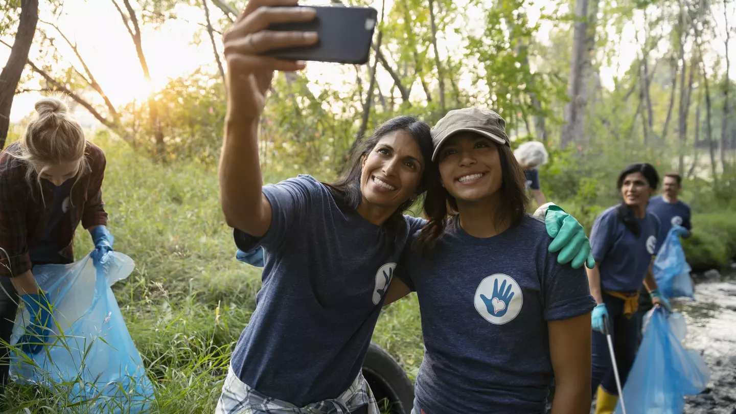Happy mother and daughter taking selfie and volunteering, cleaning up garbage in park
1051323510
Role Model, Day, EC08, Bonding, 12-13 Years, 45-49 Years, Smart Phone, Mobile Phone, Toothy Smile, Mature Women, Mature Adult, Photographing, Females, North America, Self Portrait, Communication, Standing, Support, Family, Park, Community, Woodland, Responsibility, A Helping Hand, Litter, Portrait, Clean Up, Casual Clothing, Happiness, Women, Photo Messaging, Cheerful, Teamwork, Memories, Daughter, Assistance, Adult, Cleaning, Mixed Race Person, Selfie, Altruism, Photography Themes, Nature, Computer, Social Issues, Mother, Environmental Issues, Childhood, Waist Up, Real People, Family with One Child, Love, Canada, Embracing, Child, Indian Ethnicity, Care, Weekend Activities, Portable Information Device, Dedication, Arms Outstretched, Enjoyment, Looking Up, Incidental People, T-Shirt, Picking Up, Environmental Cleanup, Single Mother, Selective Focus, Wireless Technology, Outdoors, Smiling, Girls, Self Portrait Photography, Two People, Volunteer, Efficiency, Photography, Generosity, Color Image, People, One Parent, Technology, Leaning, Community Outreach, Charity and Relief Work, Lifestyles, Part of a Series, Love - Emotion, Environmentalist, Togetherness, Pre-Adolescent Child, Affectionate, Environmental Conservation, Horizontal, Holding, Garbage, Arm Around, Garbage Bag, Social Responsibility