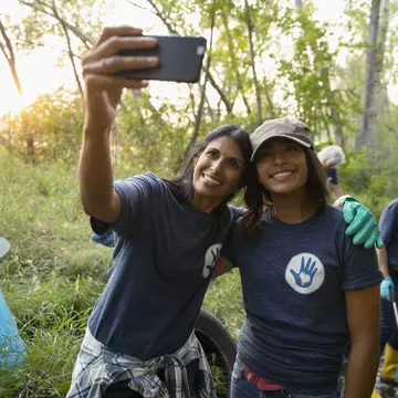 Happy mother and daughter taking selfie and volunteering, cleaning up garbage in park
1051323510
Role Model, Day, EC08, Bonding, 12-13 Years, 45-49 Years, Smart Phone, Mobile Phone, Toothy Smile, Mature Women, Mature Adult, Photographing, Females, North America, Self Portrait, Communication, Standing, Support, Family, Park, Community, Woodland, Responsibility, A Helping Hand, Litter, Portrait, Clean Up, Casual Clothing, Happiness, Women, Photo Messaging, Cheerful, Teamwork, Memories, Daughter, Assistance, Adult, Cleaning, Mixed Race Person, Selfie, Altruism, Photography Themes, Nature, Computer, Social Issues, Mother, Environmental Issues, Childhood, Waist Up, Real People, Family with One Child, Love, Canada, Embracing, Child, Indian Ethnicity, Care, Weekend Activities, Portable Information Device, Dedication, Arms Outstretched, Enjoyment, Looking Up, Incidental People, T-Shirt, Picking Up, Environmental Cleanup, Single Mother, Selective Focus, Wireless Technology, Outdoors, Smiling, Girls, Self Portrait Photography, Two People, Volunteer, Efficiency, Photography, Generosity, Color Image, People, One Parent, Technology, Leaning, Community Outreach, Charity and Relief Work, Lifestyles, Part of a Series, Love - Emotion, Environmentalist, Togetherness, Pre-Adolescent Child, Affectionate, Environmental Conservation, Horizontal, Holding, Garbage, Arm Around, Garbage Bag, Social Responsibility