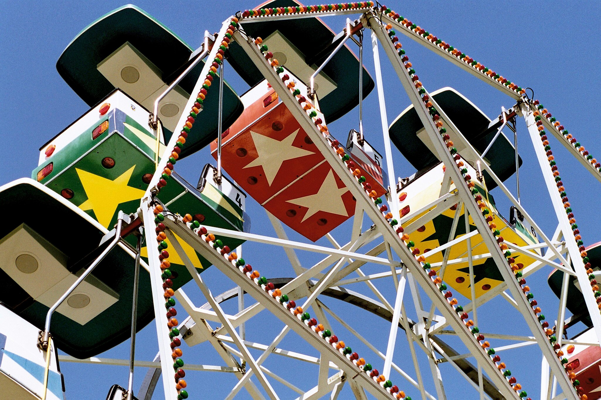 Ferris wheel against the blue sky at amusement park Tivoli Friheden, Aarhus, Denmark.