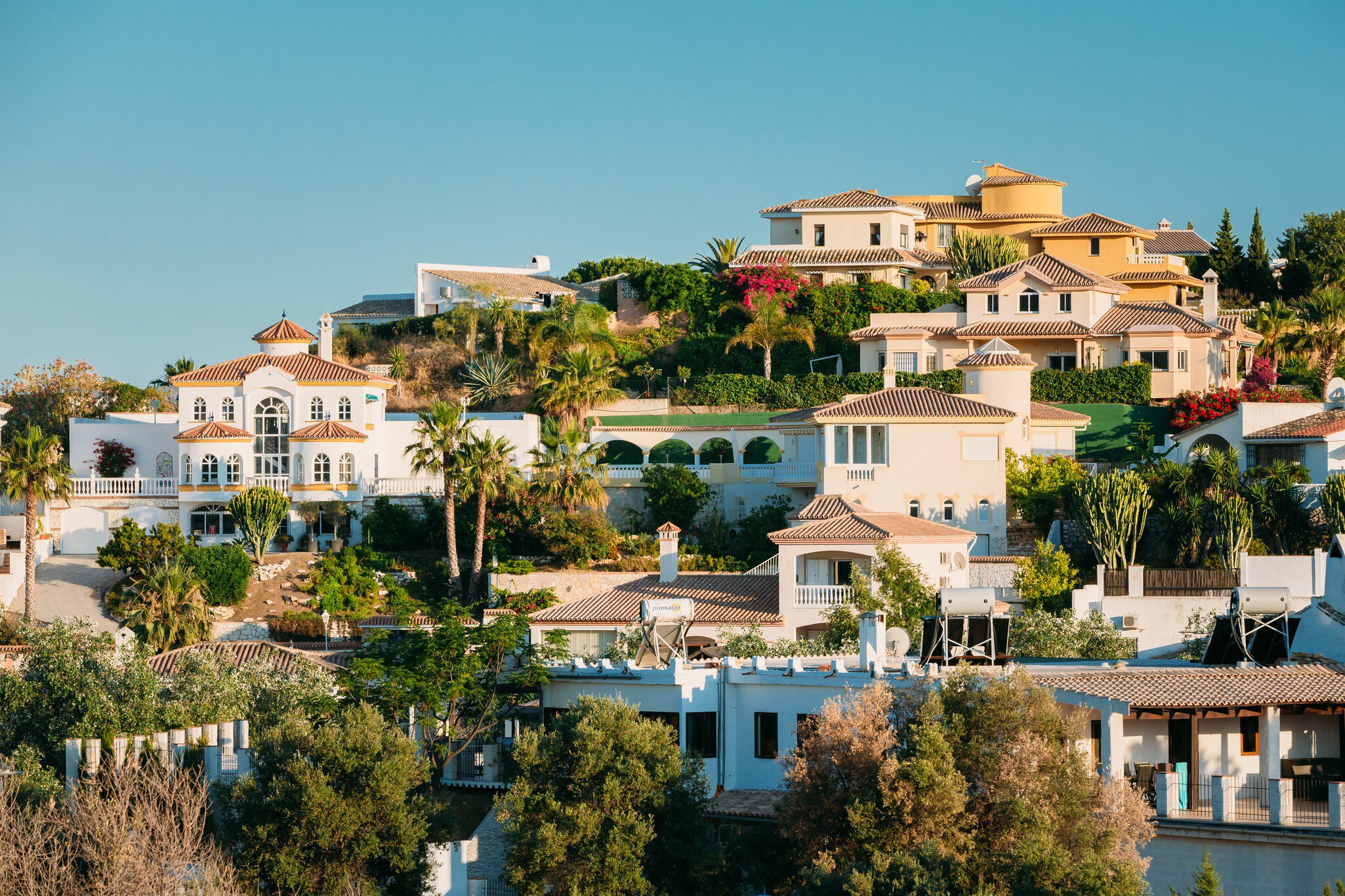 Aerial view of the white hilltop houses in the village of Mijas Pueblo on the Costa del Sol in Spain.