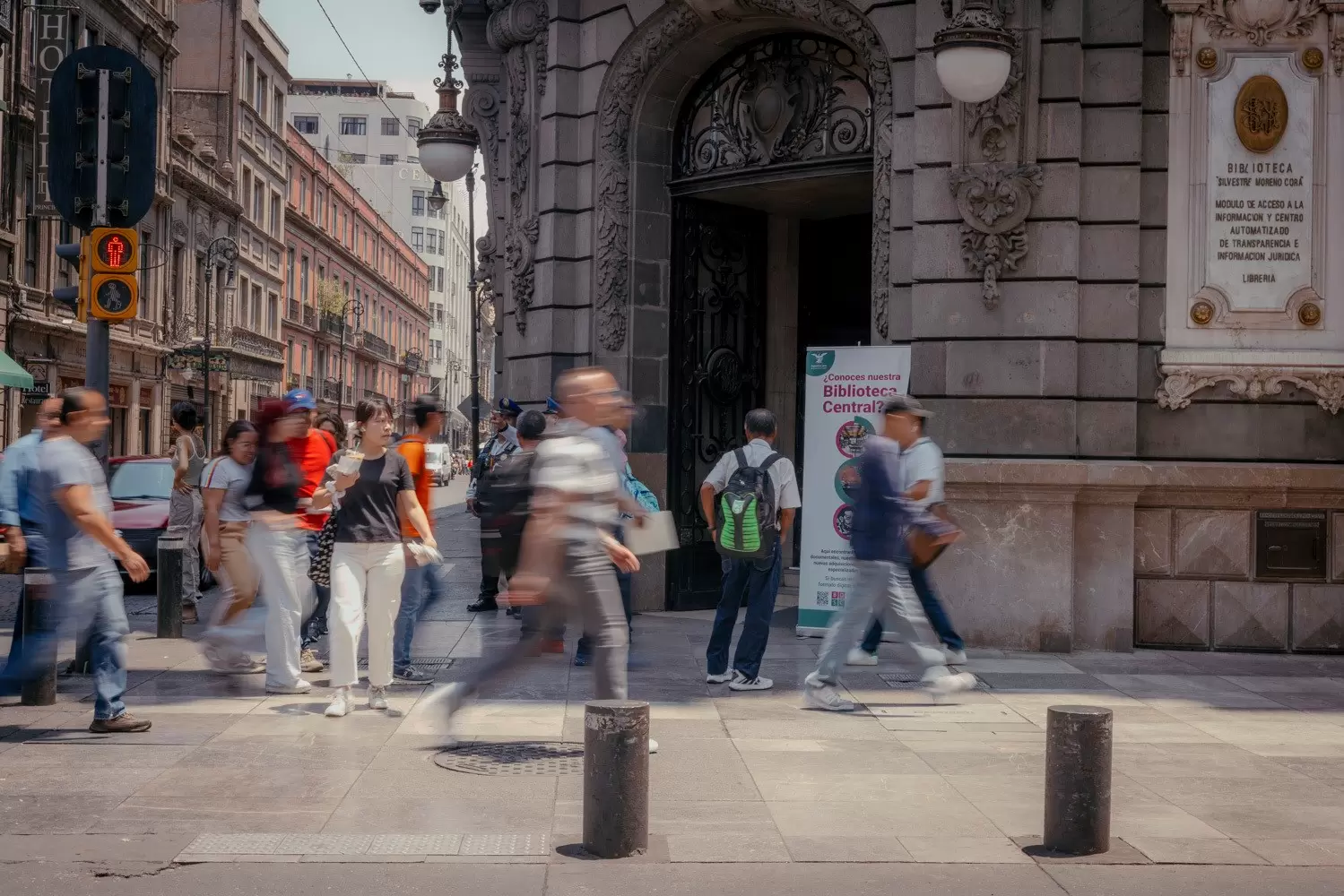 People walking in the Centro Histórico neighborhood, with historic buildings behind them