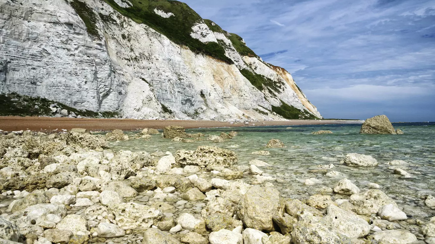 Dover chalk cliffs coastal erosion, as seen from the sea. ©Ryan Ladbrook/Shutterstock