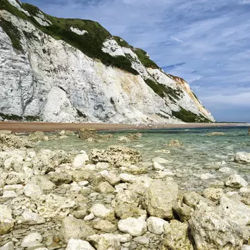 Dover chalk cliffs coastal erosion, as seen from the sea. ©Ryan Ladbrook/Shutterstock