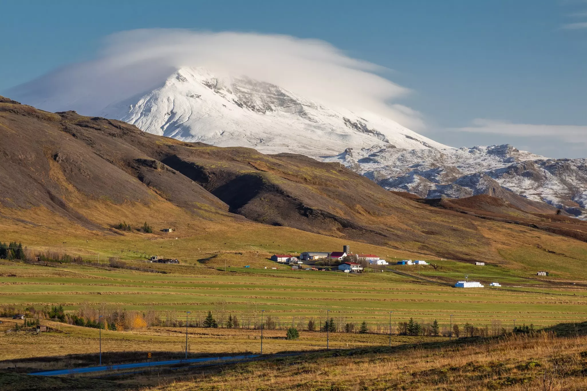 A tiny settlement at the foot of a snowcapped mountain