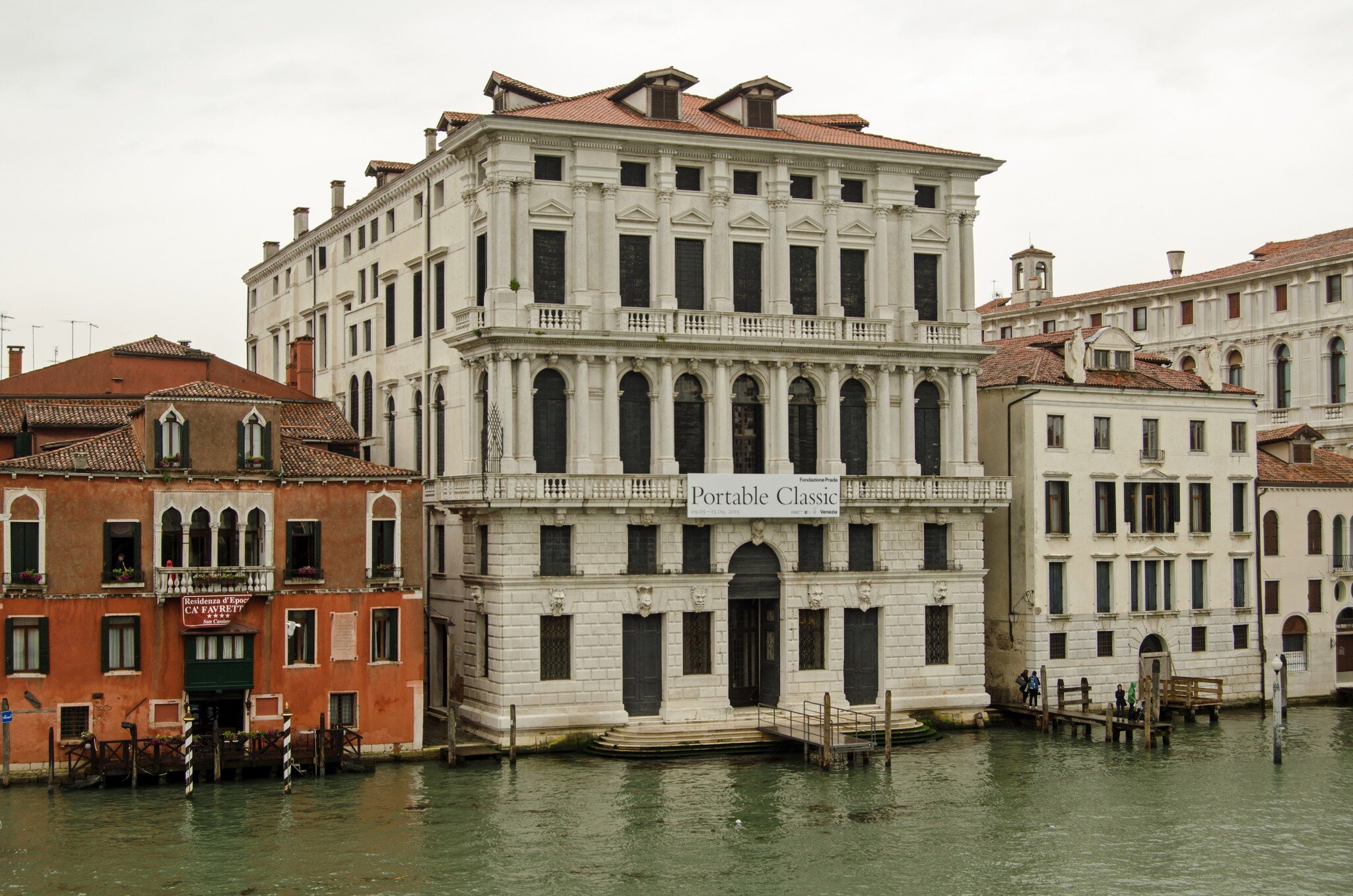 Venice, Italy - May 22, 2015: View across the Grand Canal of the new art gallery Fondazione Prada in Venice, Italy.  On a rainy day in May.