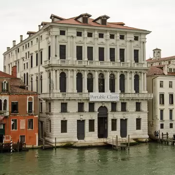 Venice, Italy - May 22, 2015: View across the Grand Canal of the new art gallery Fondazione Prada in Venice, Italy.  On a rainy day in May.