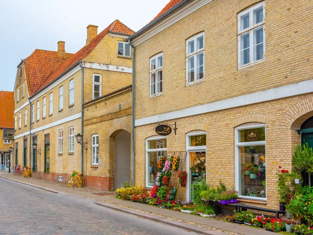 Traditional street with a flower shop in Danish town Christiansfeld, Denmark.