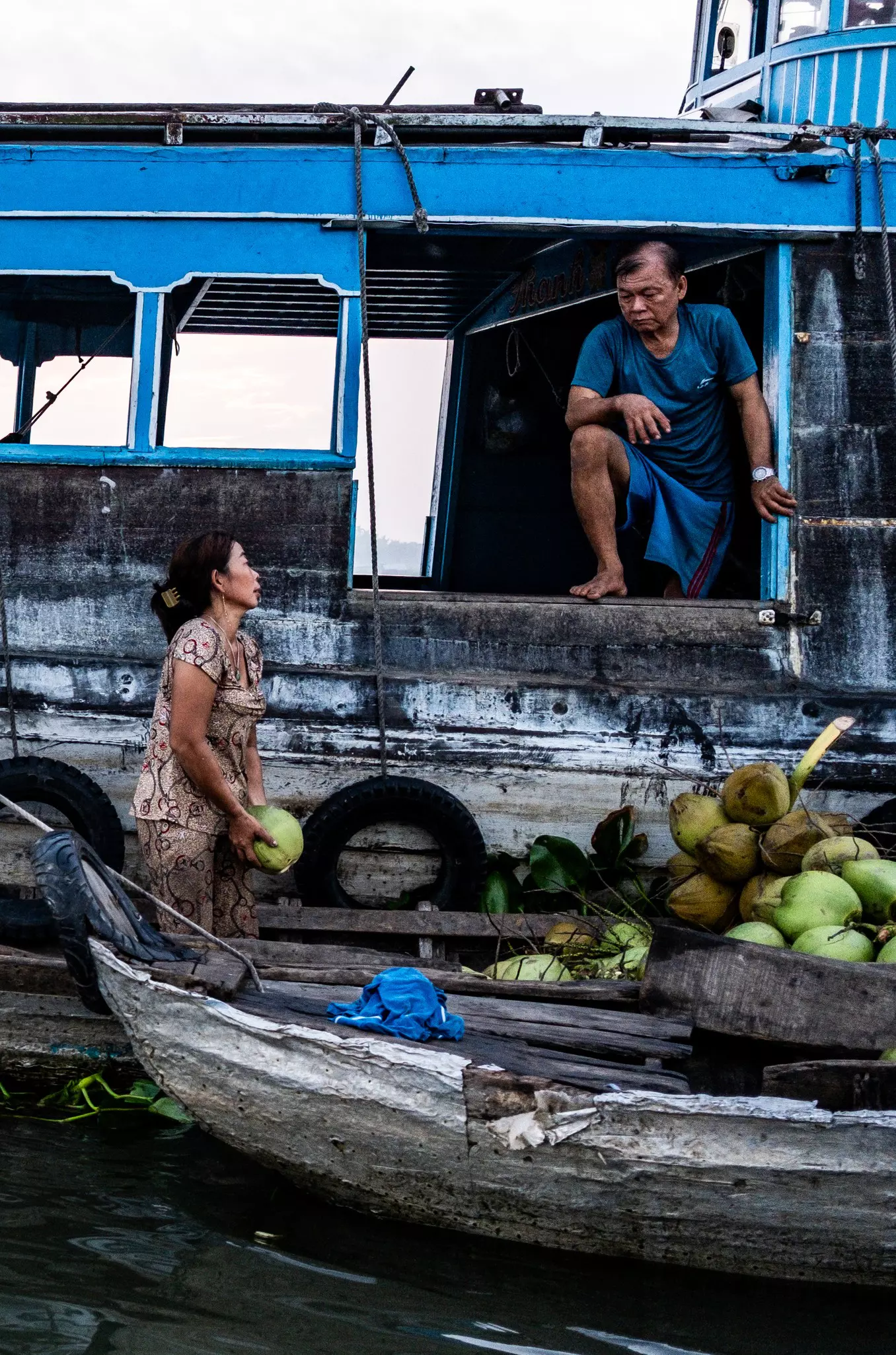 Traders at Long Xuyen floating market, An Giang