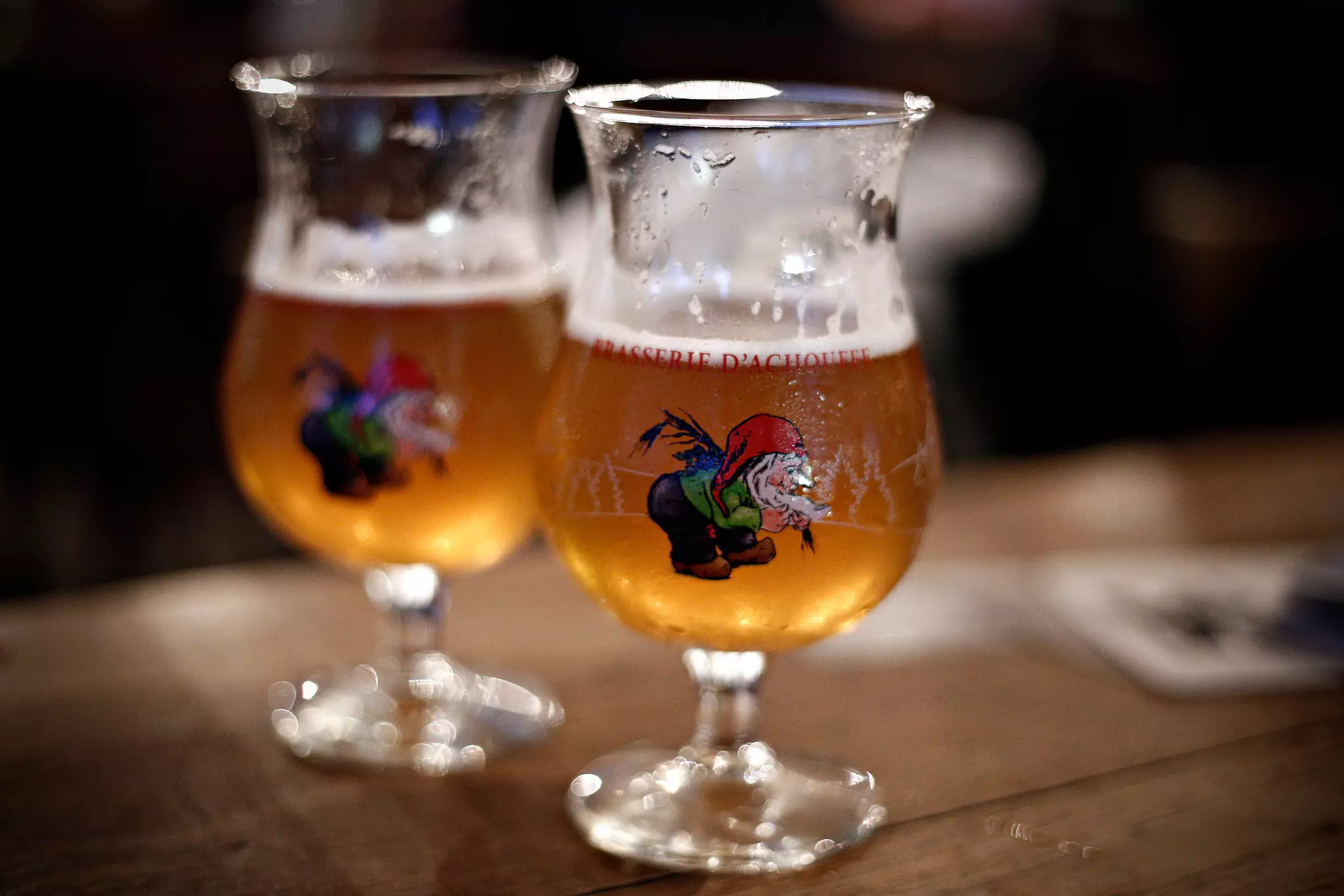 Two glasses of Belgian beer on a table