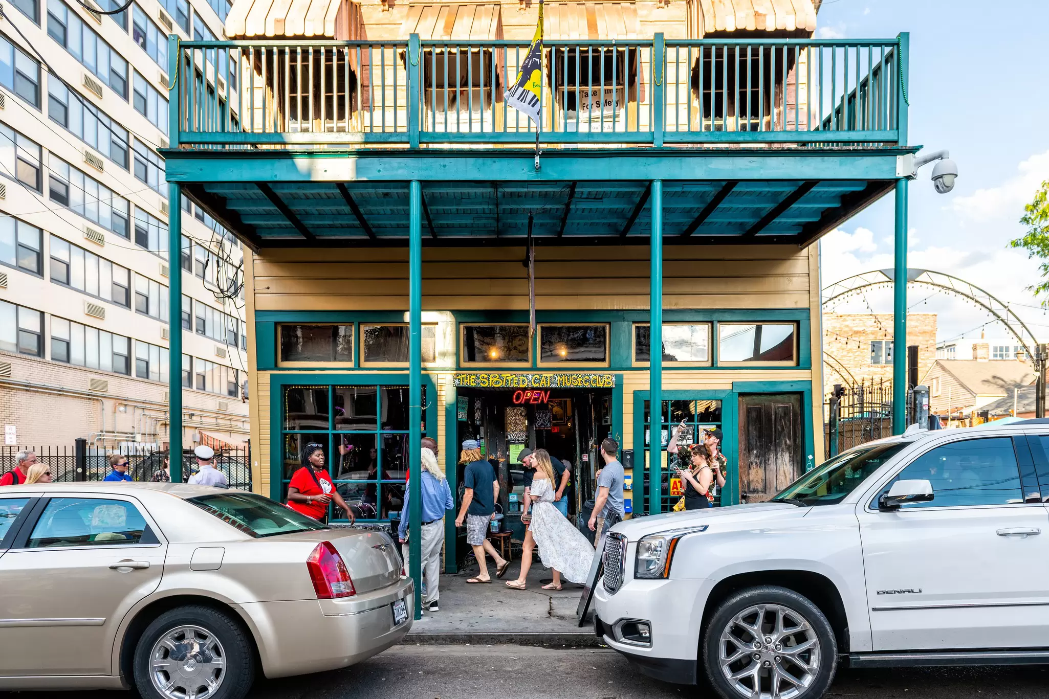 People walk by the famous Spotted Cat Music Club on Frenchmen street in New Orleans, Louisiana.